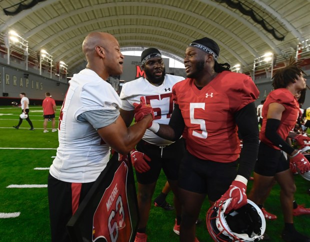 Gov. Wes Moore has Maryland defensive lineman Quashon Fuller at the team's practice. (Kenneth K. Lam/staff)