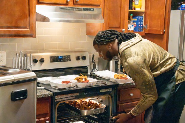 Maryland defensive end Quashon Fuller prepares fried chicken and red velvet waffles at his home. (Daniel Kraft/Maryland Athletics)